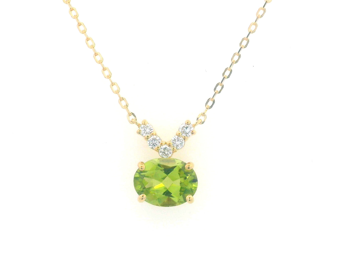 18K gold necklace featuring a 1.68-carat oval Peridot pendant with a 0.15-carat diamond cluster accent in a V-shape, suspended from a fine gold chain.