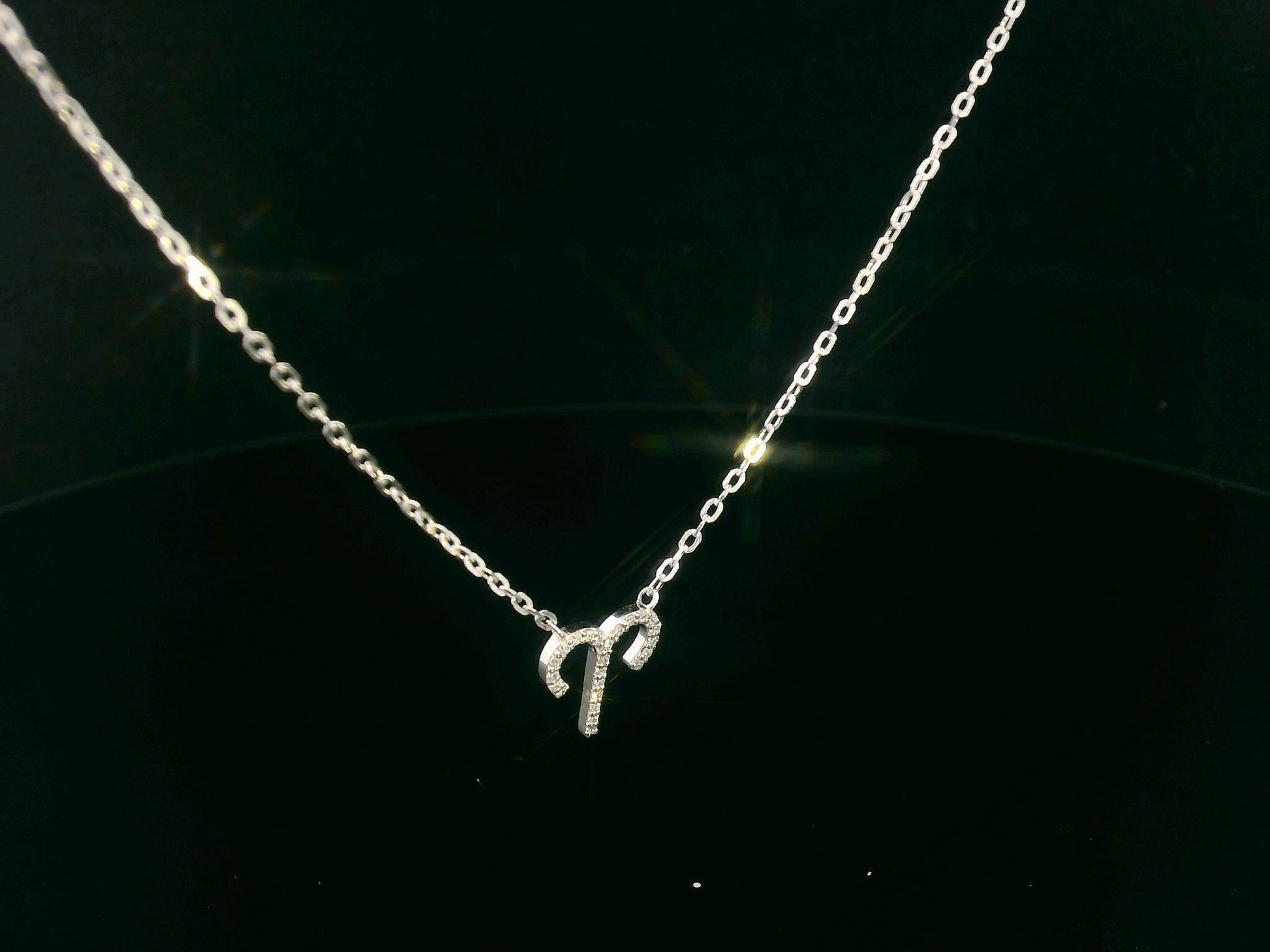 18K gold Aries zodiac necklace with diamond accents – 0.09 carat total.