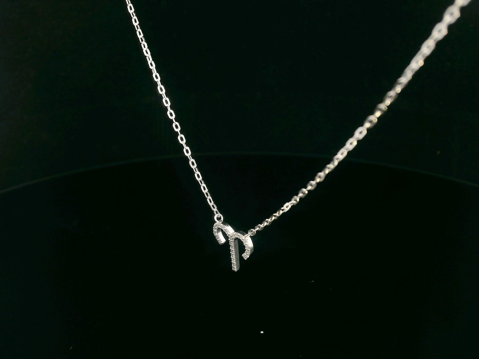 18K gold Aries zodiac necklace with diamond accents – 0.09 carat total.