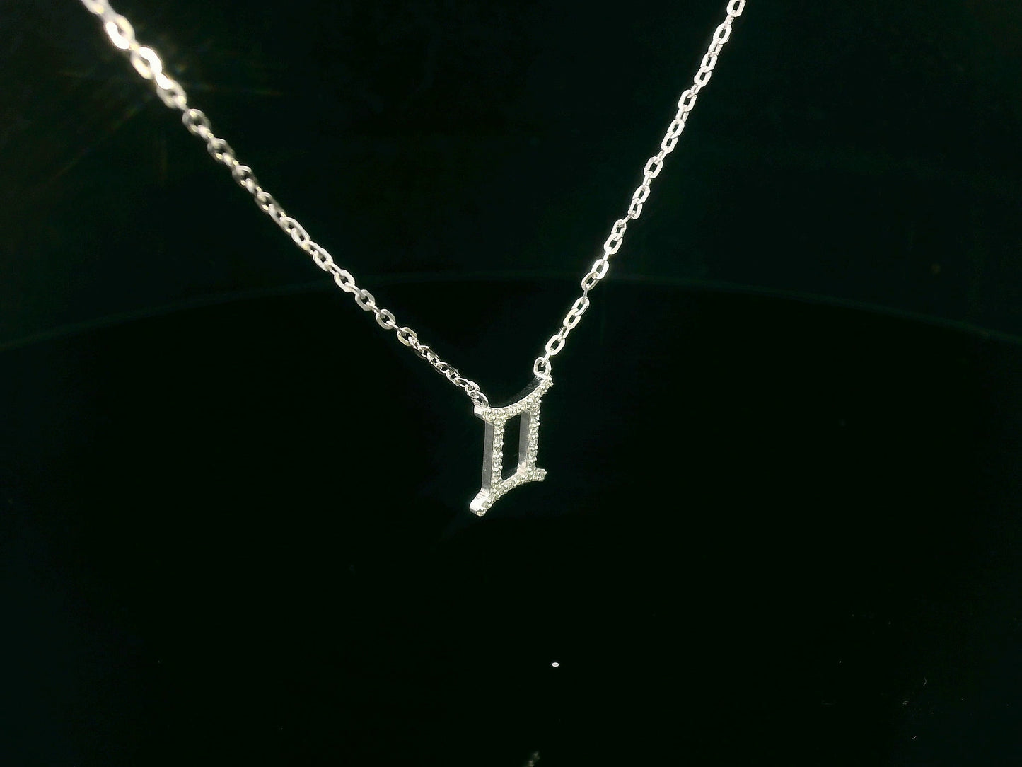 Gemini zodiac necklace in 18K white gold set with 0.10 carat round diamonds on fine chain