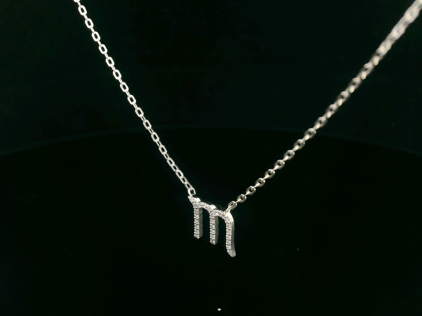 Scorpio zodiac necklace in 18K gold set with 0.09 carat round diamonds on delicate chain