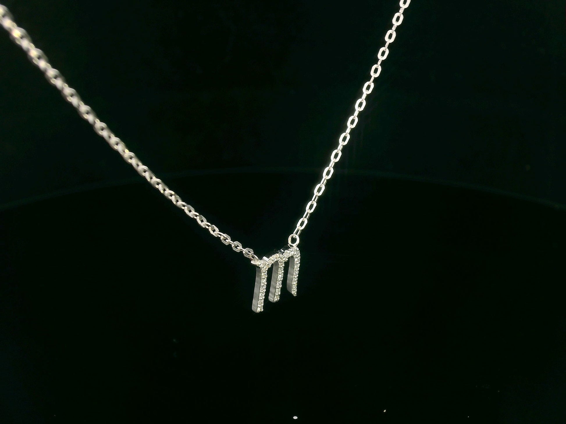Scorpio zodiac necklace in 18K gold set with 0.09 carat round diamonds on delicate chain