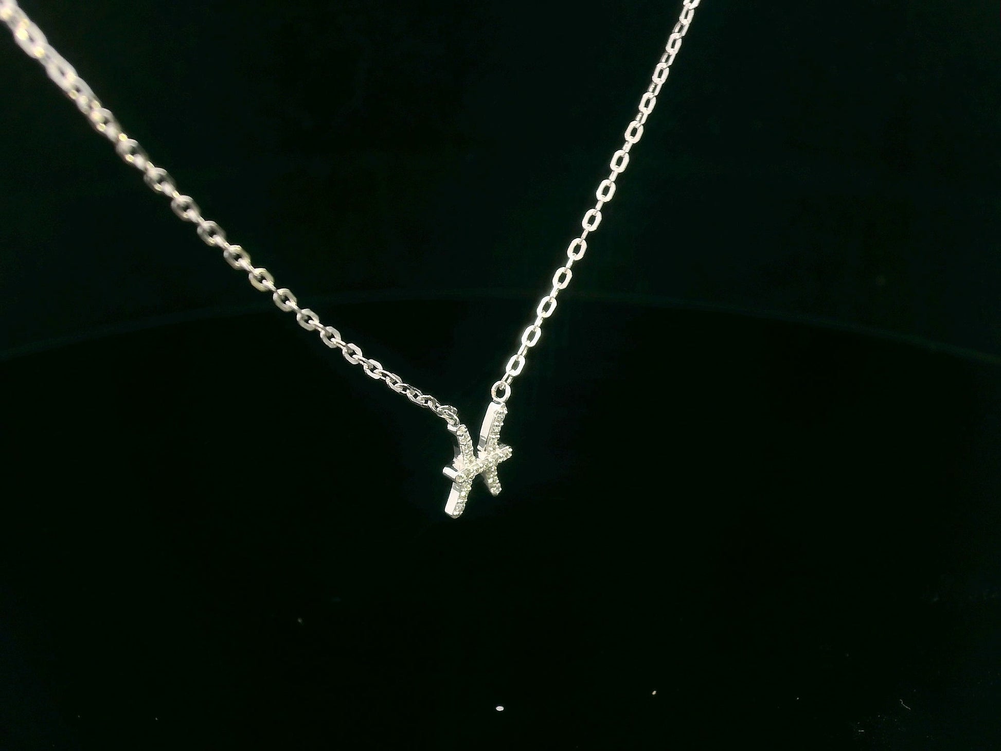 Pisces zodiac necklace in 18K gold with 0.06 carat diamond accents on fine chain