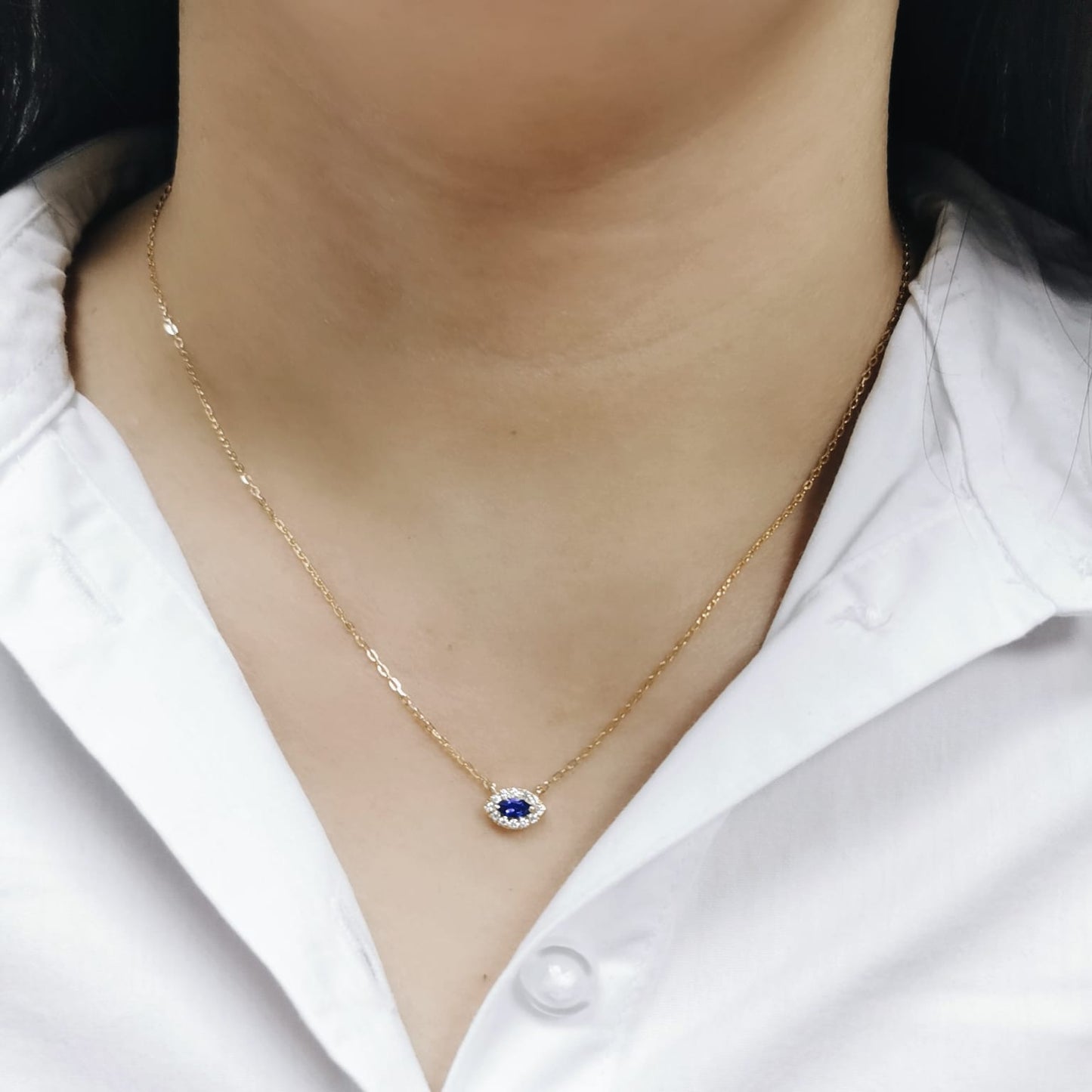 Minimalist marquise-cut Tanzanite pendant necklace in 18K yellow gold with diamond halo