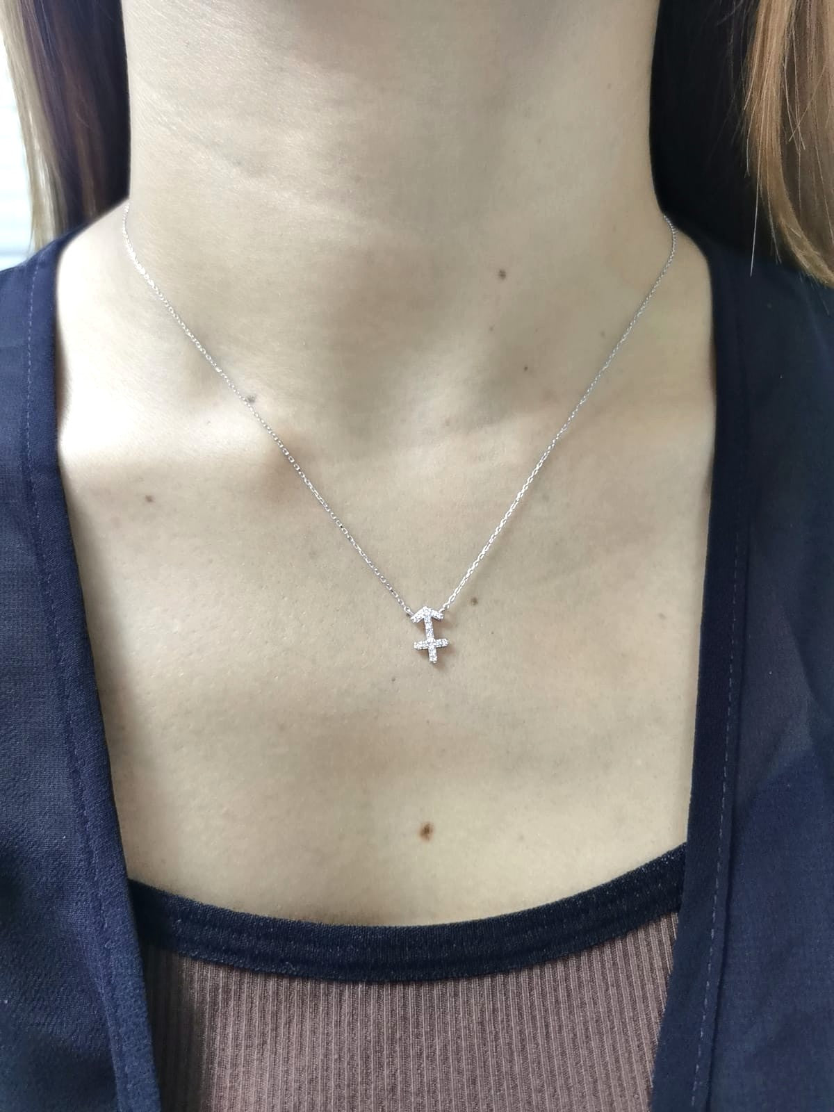 Sagittarius zodiac necklace in 18K white gold with diamond-studded symbol, 0.08 carat total.