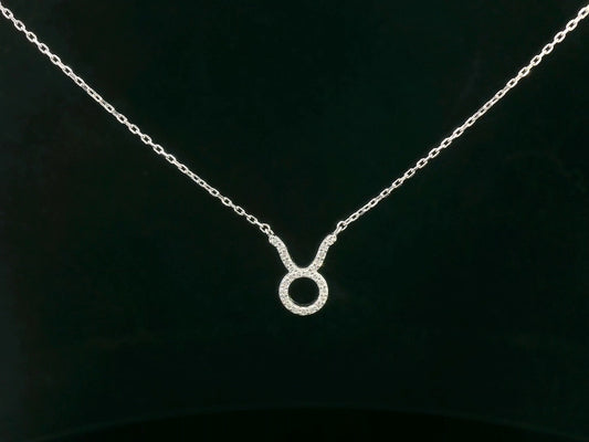Taurus zodiac sign necklace in 18K white gold with 0.09 carat diamond accents.
