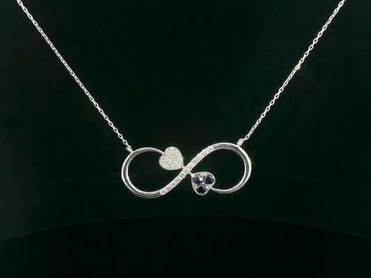 18K gold infinity necklace with heart-shaped diamond and sapphire accents, total 0.21 CT each