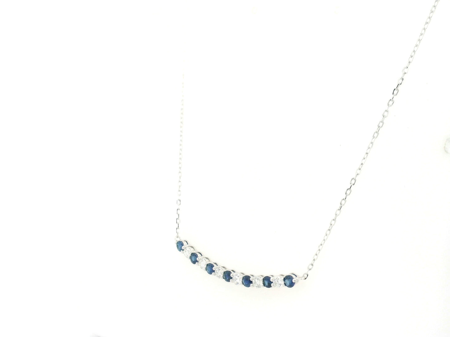 Blue sapphire and diamond bar necklace in 18K white gold featuring 0.74 carats of sapphires and 0.55 carats of diamonds by Emirates Diamonds.