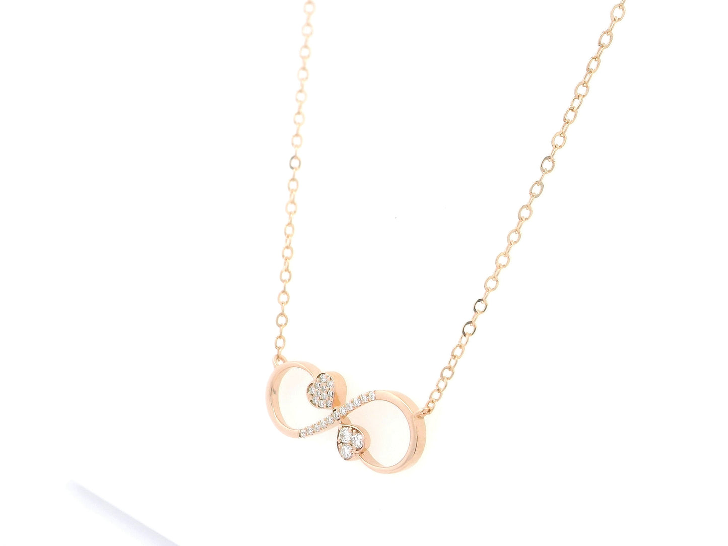 18K rose gold infinity heart necklace with pavé diamonds and double heart design.