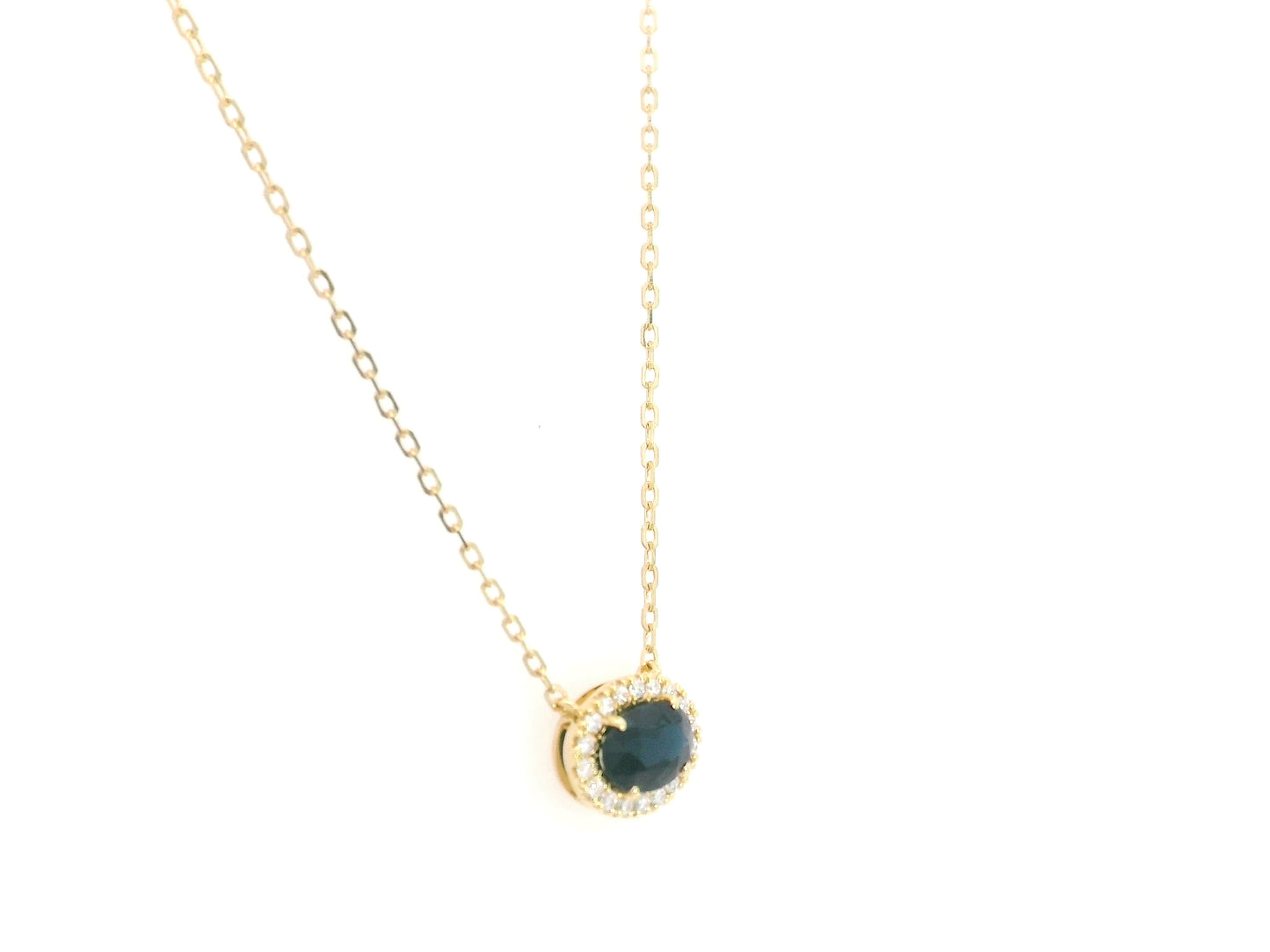 18K yellow gold sapphire and diamond halo pendant necklace with oval blue sapphire center stone