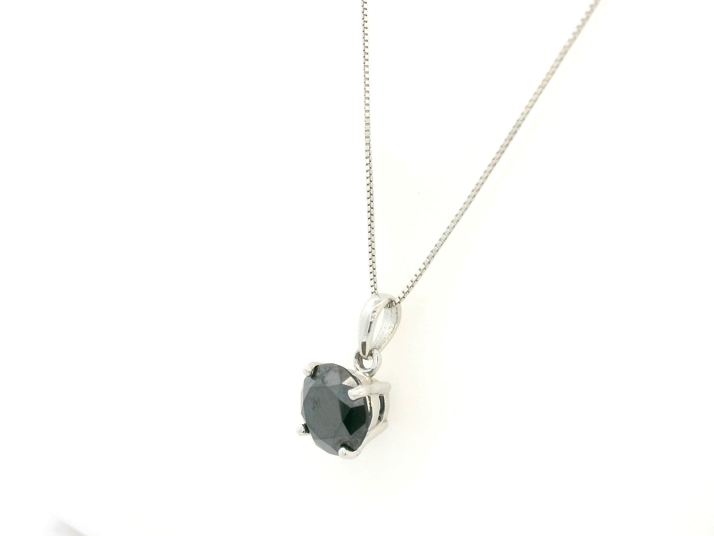 18K white gold black diamond solitaire pendant with 4.43 carat round black diamond, luxury jewelry by Emirates Diamonds.