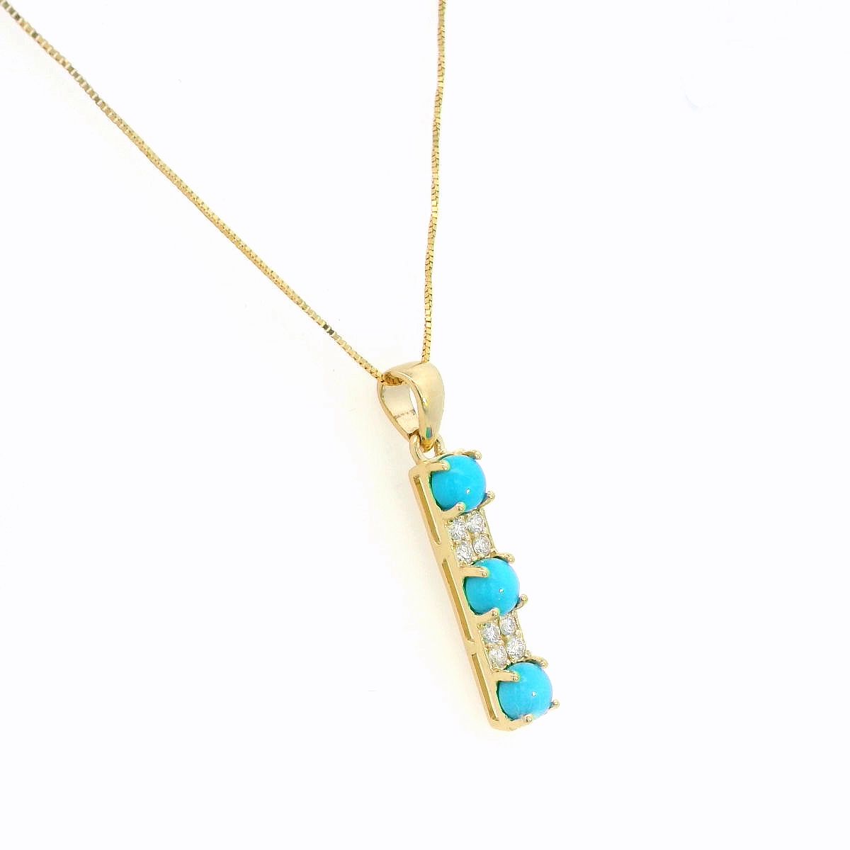 Turquoise and diamond drop pendant in 18K yellow gold featuring three round blue turquoise gemstones totalling 0.90 carat, alternating with round diamond accents totalling 0.14 carat. Chain sold separately