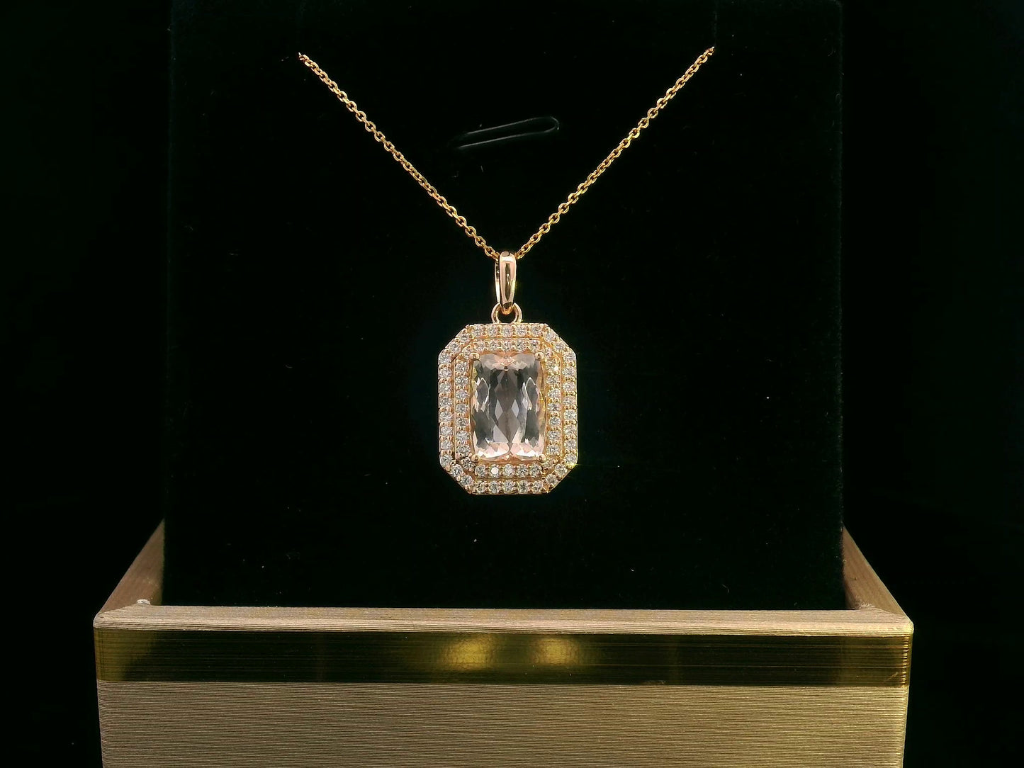 18K gold emerald-cut morganite pendant featuring a 2.18-carat blush pink morganite with a double halo of 0.40-carat diamonds. Luxury fine jewelry piece.