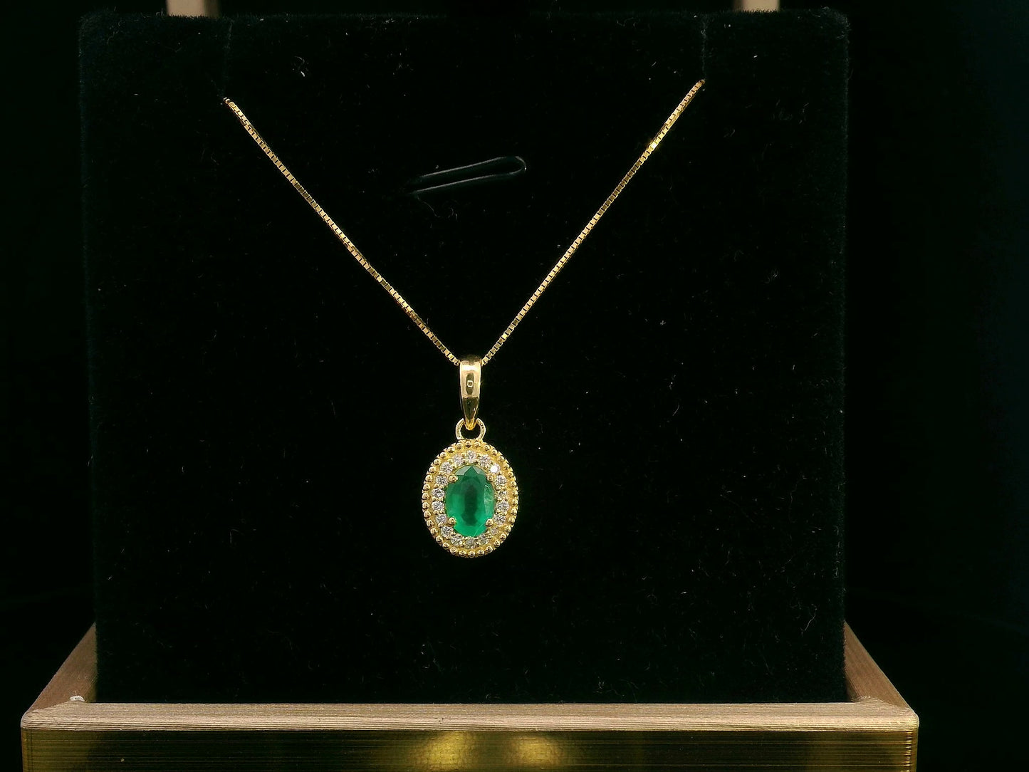 Oval-Cut Emerald & Diamond Halo Pendant in 18K Gold
