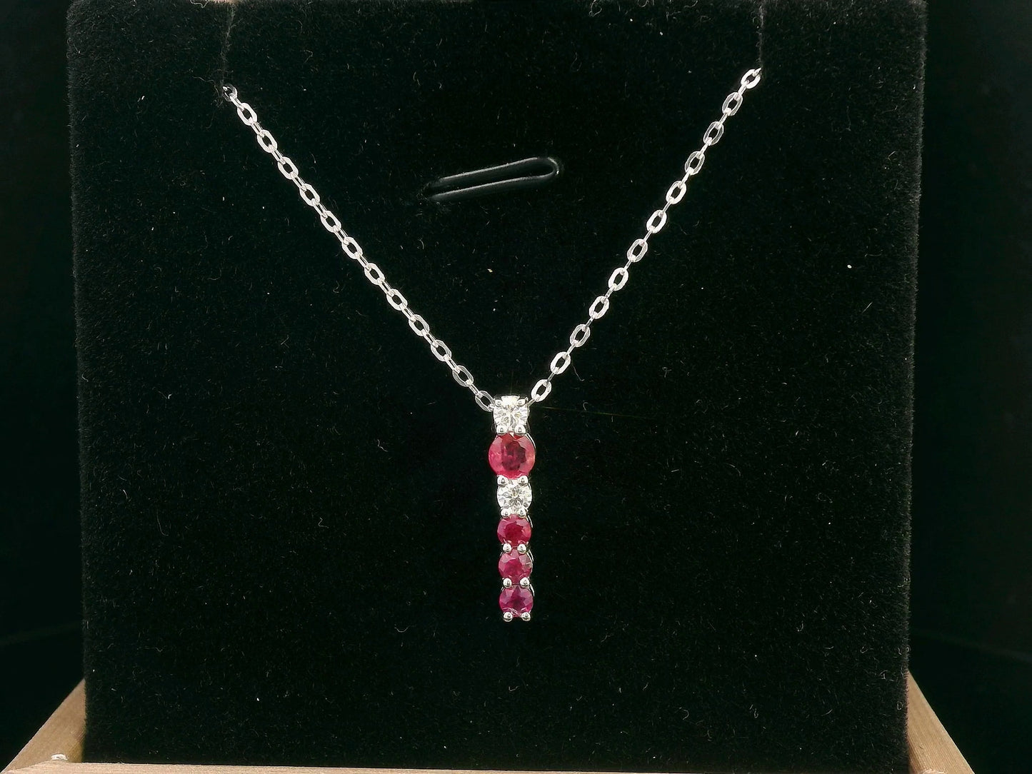 18K gold ruby and diamond vertical bar pendant necklace, featuring 0.50 carats of rubies and 0.13 carats of diamonds – dainty July birthstone jewelry for women.