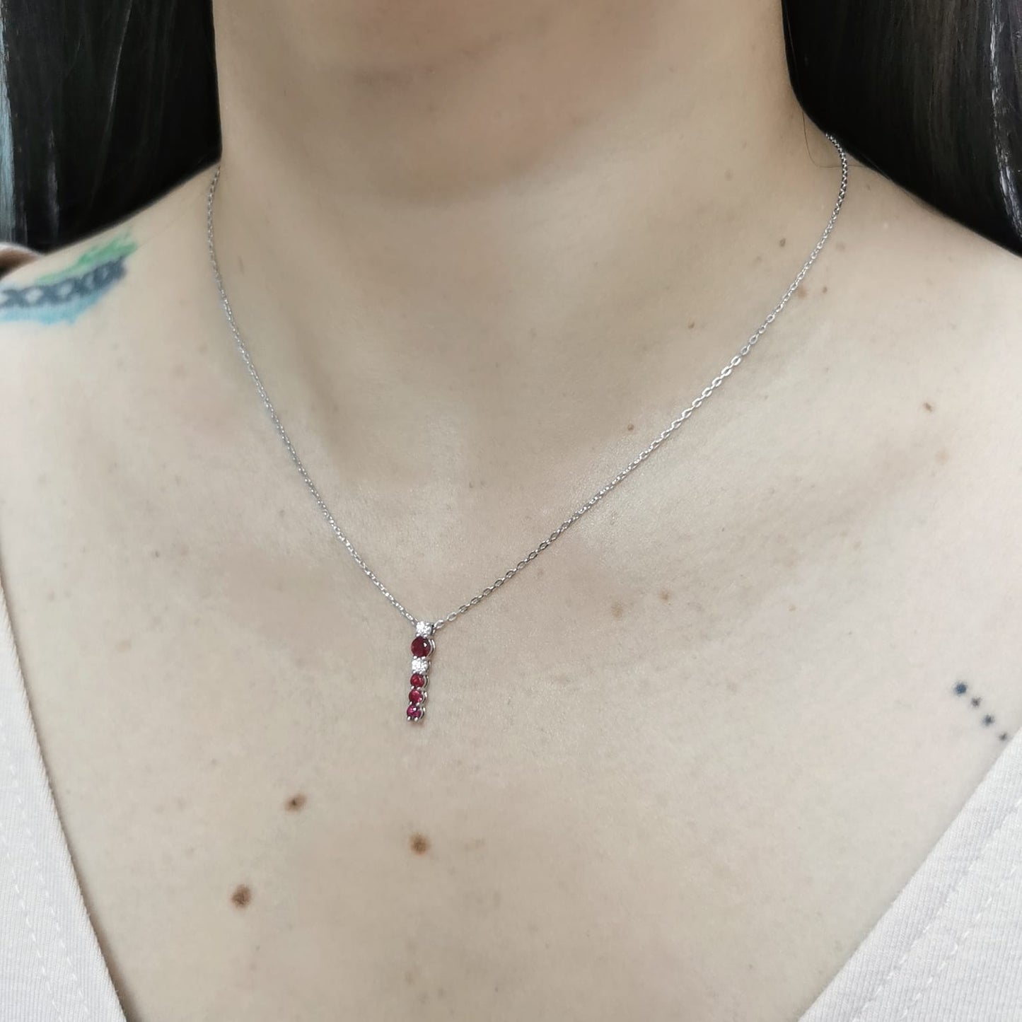 18K gold ruby and diamond vertical bar pendant necklace, featuring 0.50 carats of rubies and 0.13 carats of diamonds – dainty July birthstone jewelry for women.