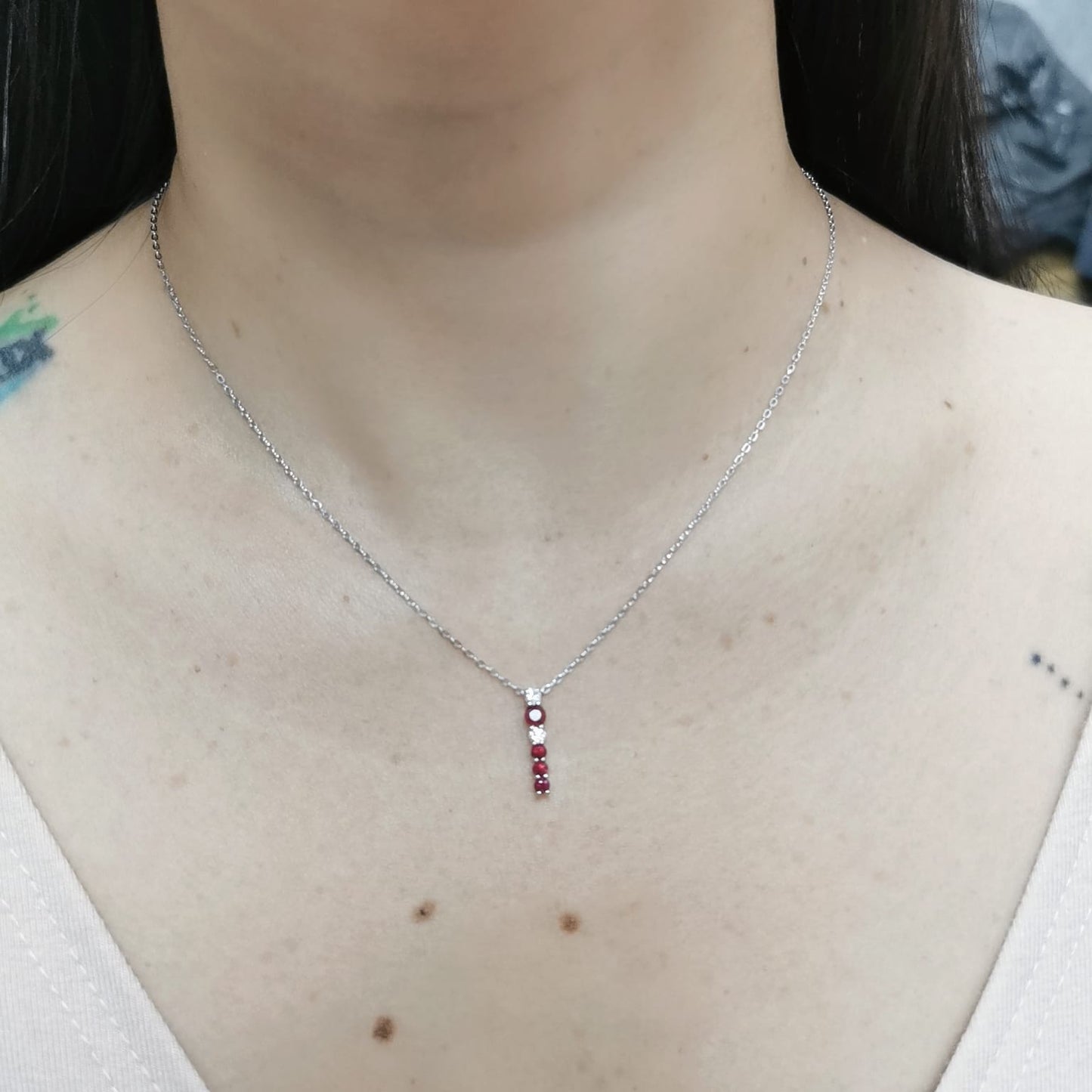 18K gold ruby and diamond vertical bar pendant necklace, featuring 0.50 carats of rubies and 0.13 carats of diamonds – dainty July birthstone jewelry for women.