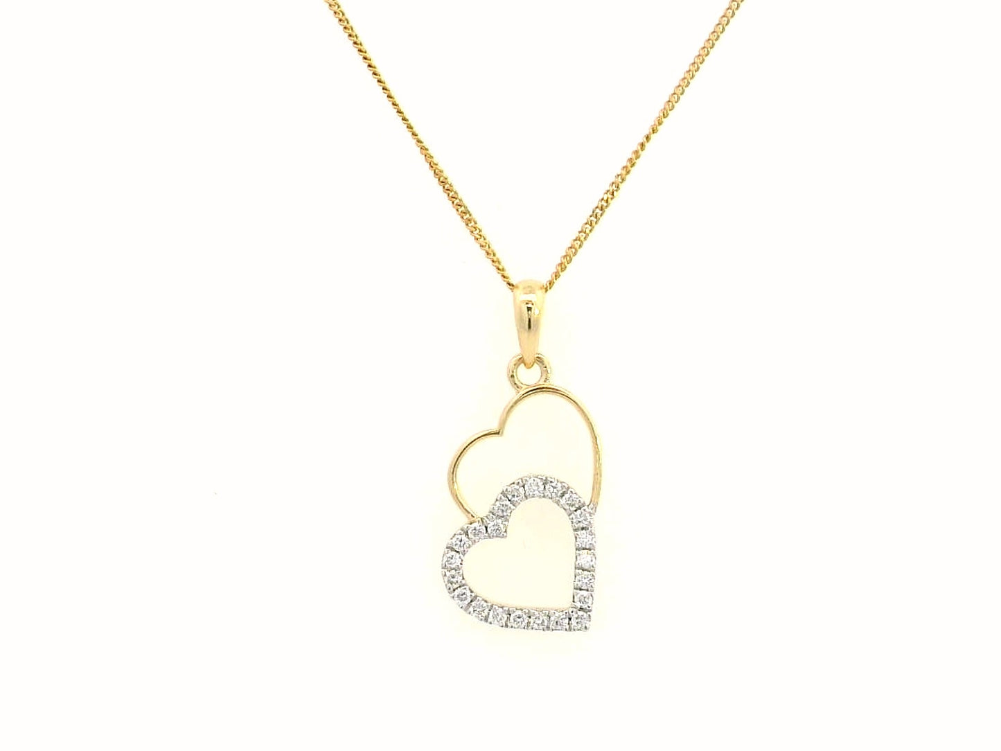 18K gold double-heart pendant with 0.10ct diamonds. Chain not included.