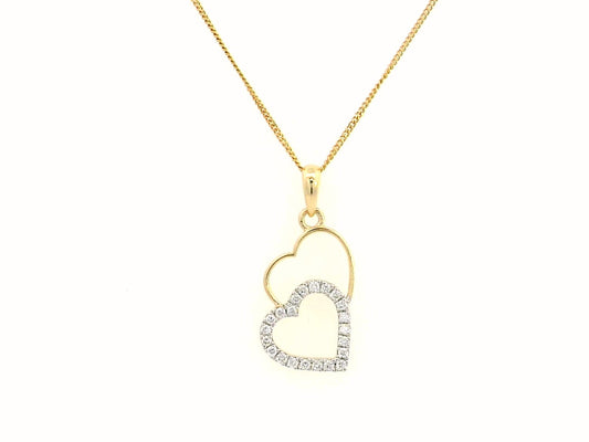 18K gold double-heart pendant with 0.10ct diamonds. Chain not included.