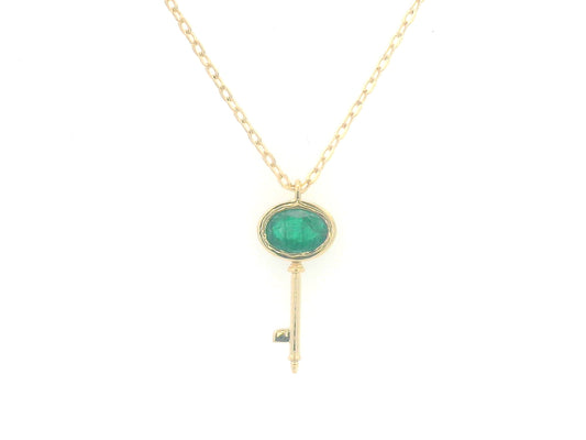 18K gold key pendant necklace with a 0.39ct natural emerald, featuring a sleek bezel setting and a delicate gold chain.