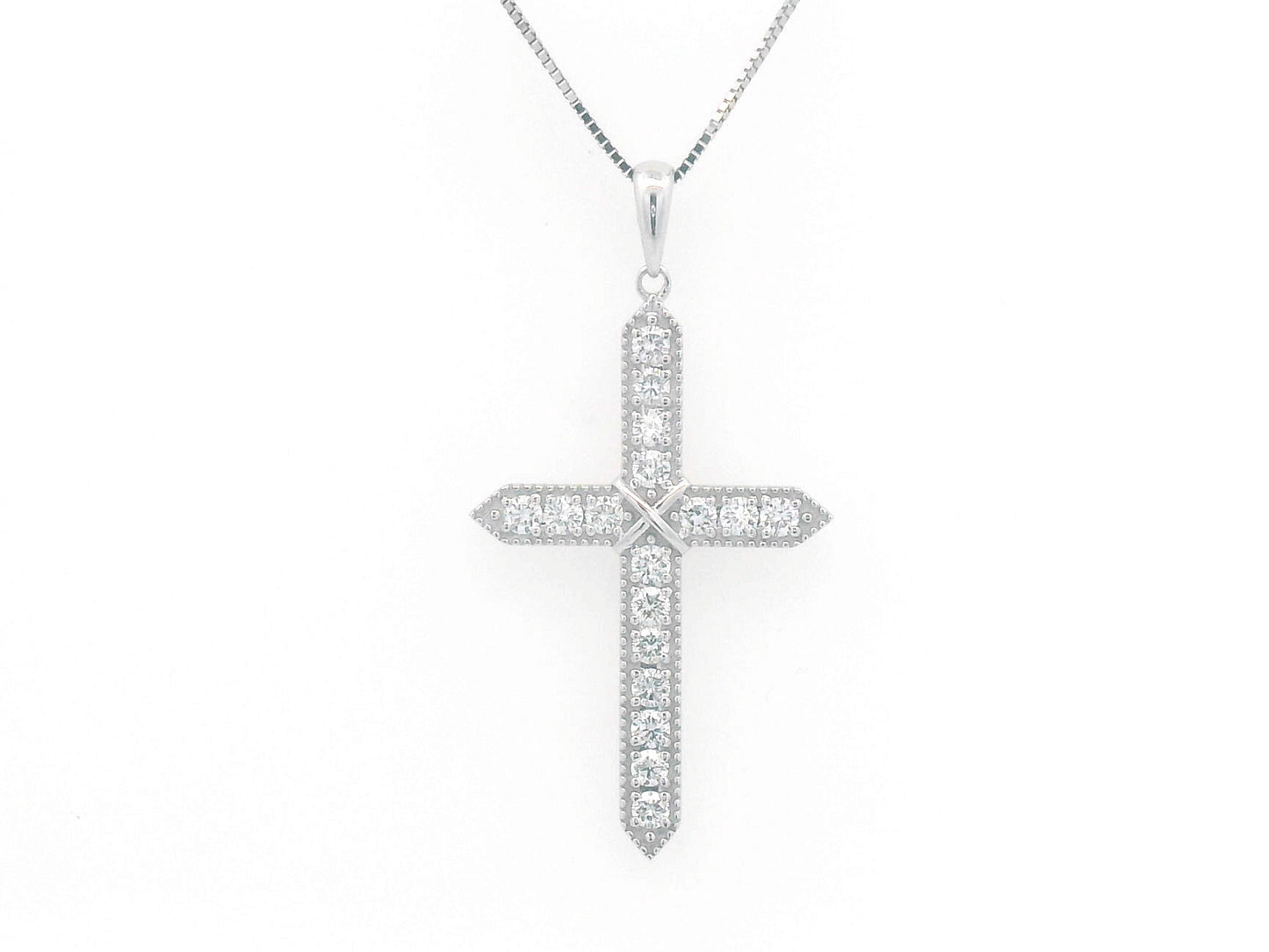 18K gold cross pendant with 0.34ct round-cut diamonds, featuring a sleek, shimmering design.