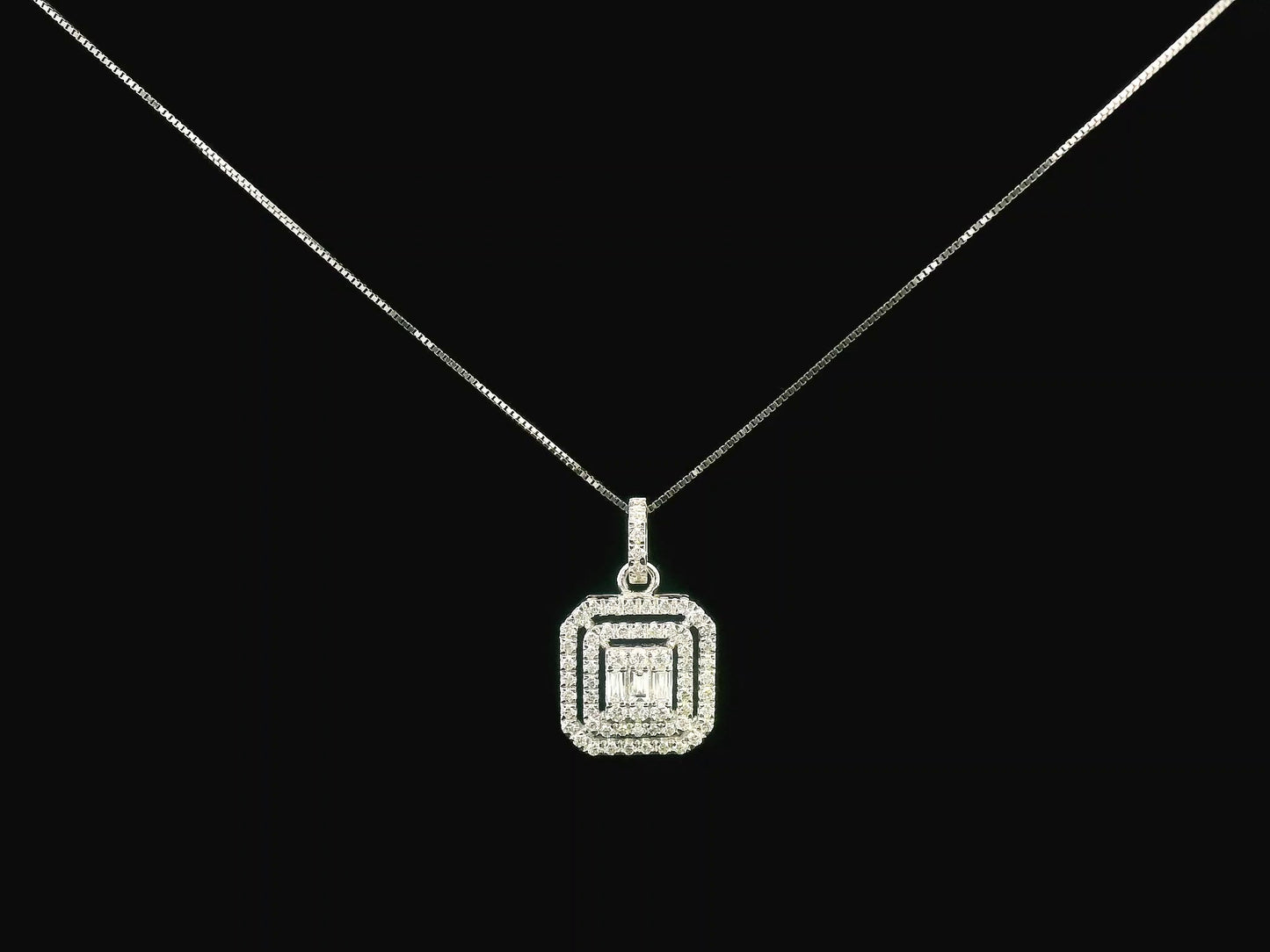 18K gold diamond pendant featuring baguette and round-cut diamonds, totaling 0.50ct, with a radiant double halo design.