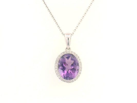 18K yellow gold pendant featuring a 2.50-carat oval Amethyst with a delicate 0.11-carat diamond halo. Elegant and timeless.