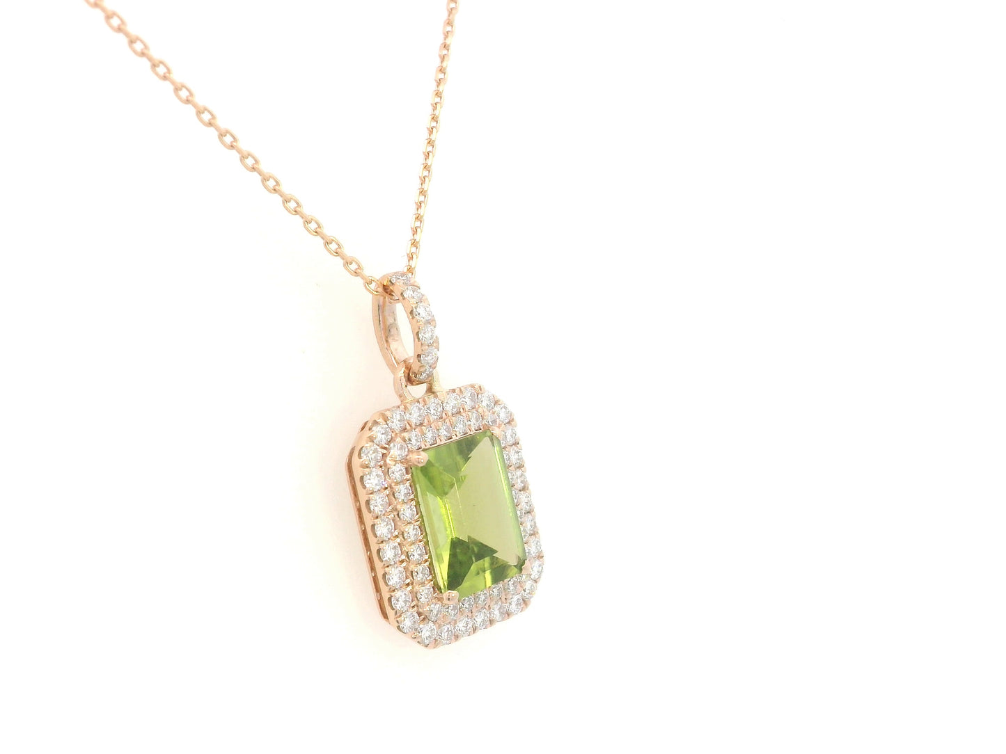 18K rose gold pendant with emerald-cut Peridot and diamond halo, 1.52ct Peridot and 0.40ct diamonds, chain not included.