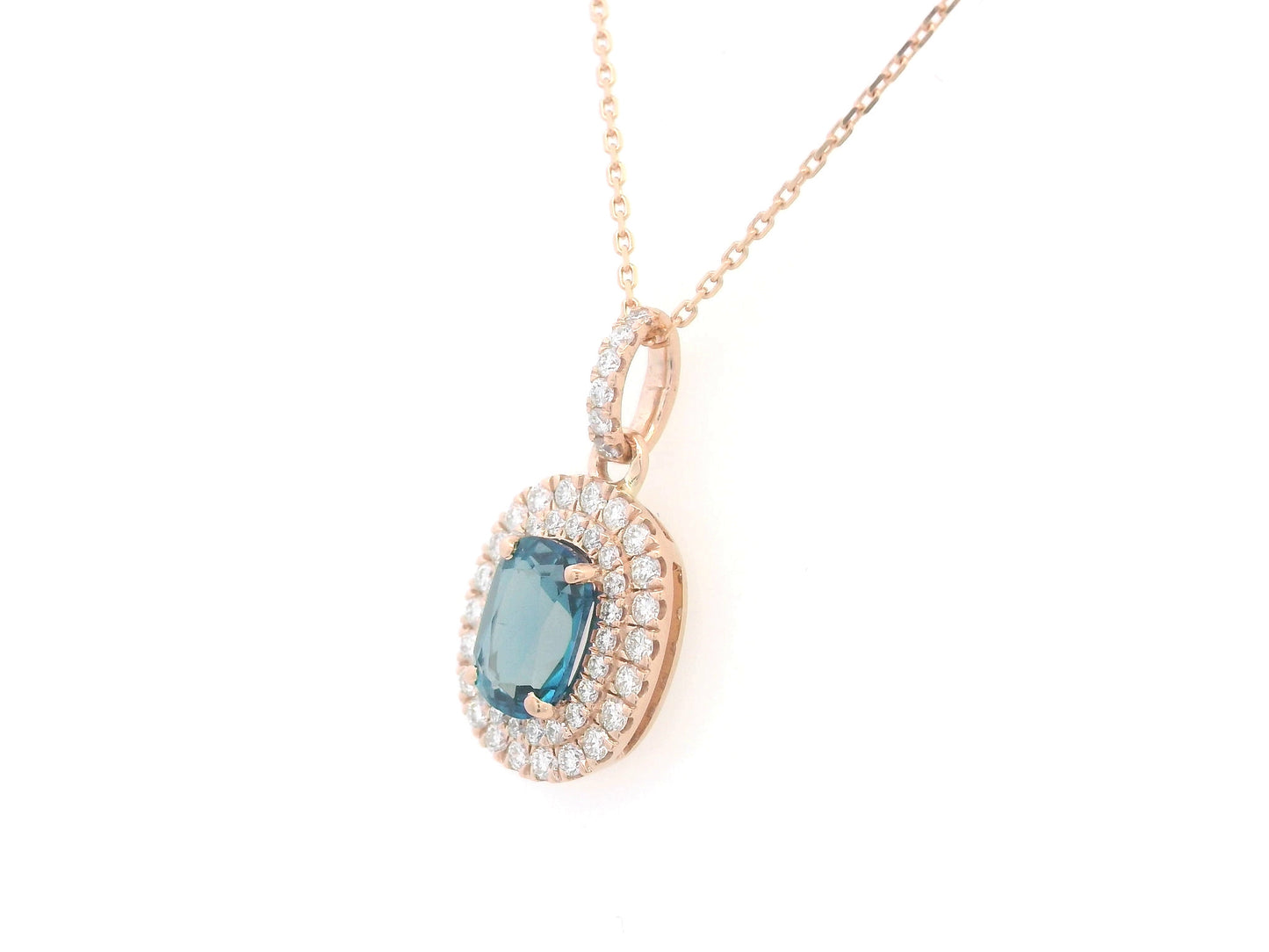 18K rose gold pendant with oval London Blue Topaz and diamond halo, 1.07ct Topaz and 0.35ct diamonds, chain not included.