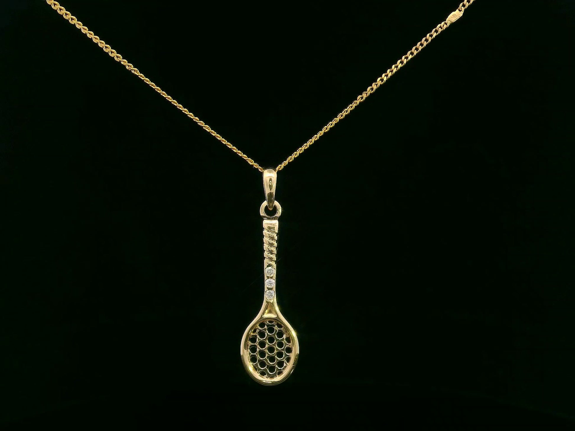 18K yellow gold tennis racket pendant with diamond handle detailing
