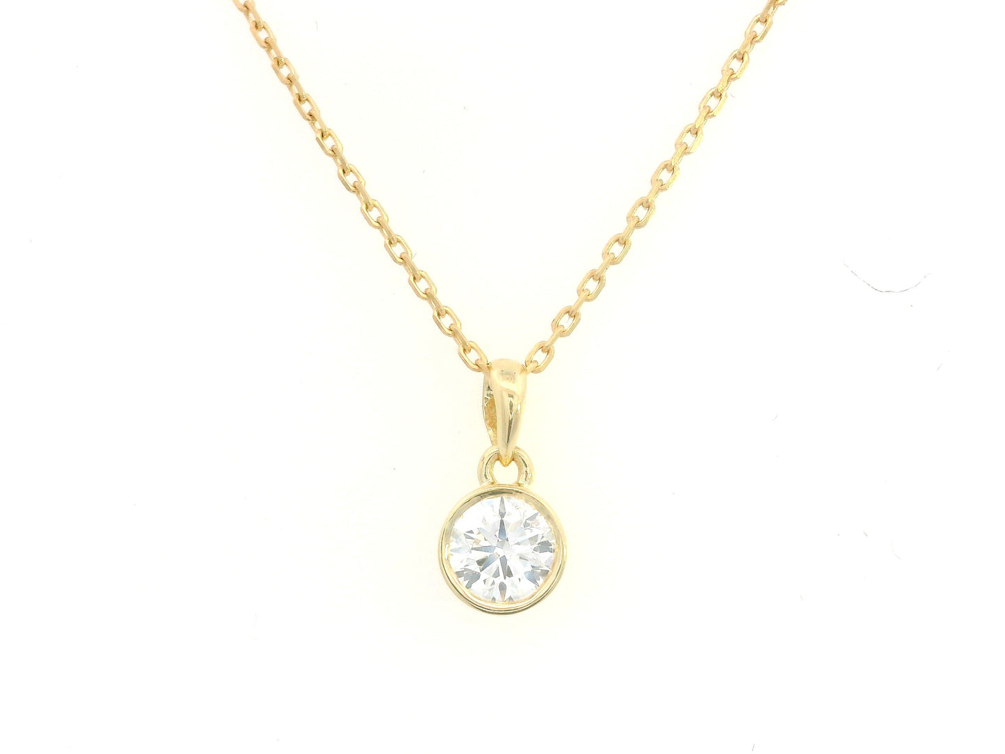 Bezel set 0.56ct round diamond pendant in 18K yellow gold without chain – minimal solitaire necklace