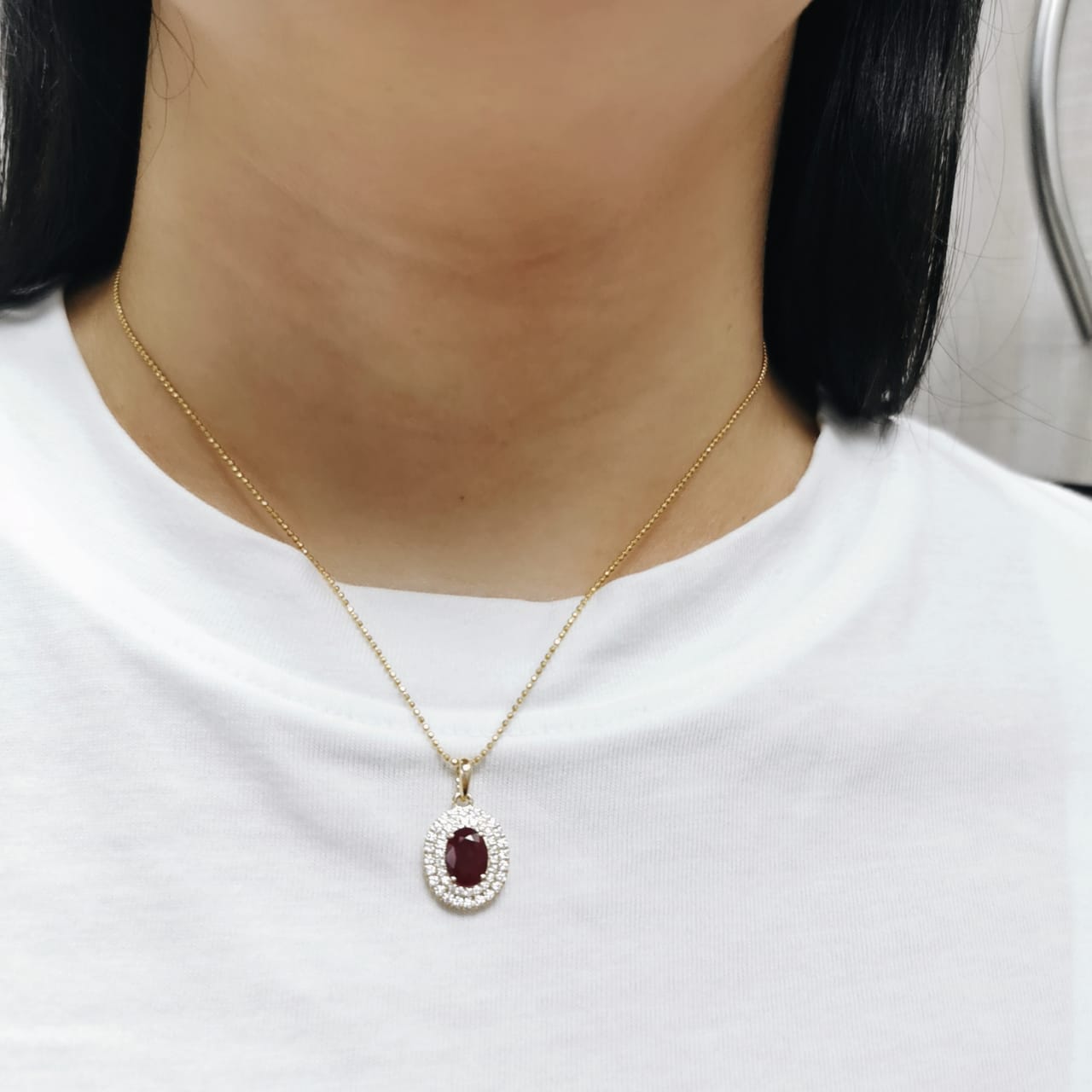 18K Gold Pendant with 1.31 Carat Oval Ruby and Double Diamond Halo