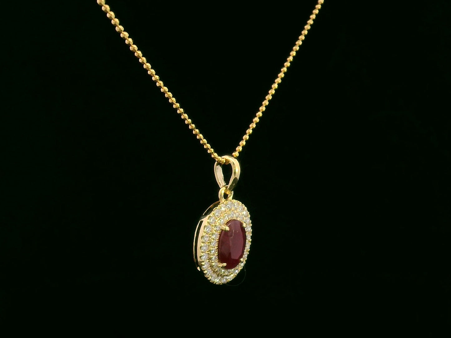 18K Gold Pendant with 1.31 Carat Oval Ruby and Double Diamond Halo