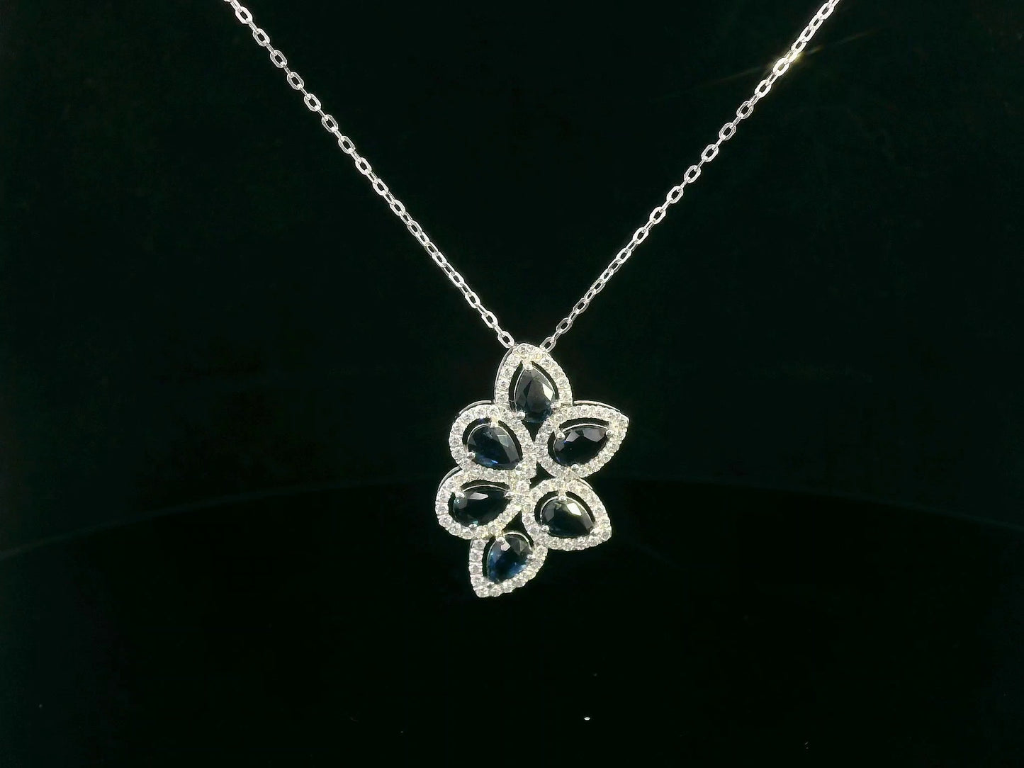 18K White Gold Blue Sapphire & Diamond Flower Pendant.