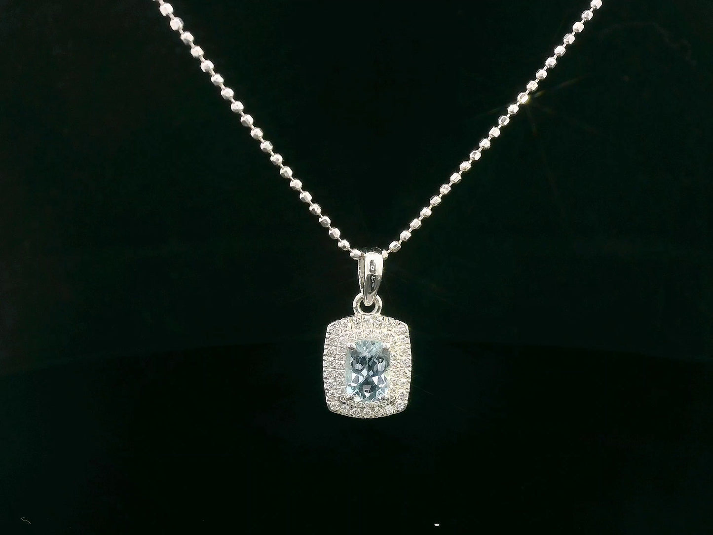 18K white gold aquamarine pendant with double diamond halo, 0.62ct cushion-cut center, and 0.24ct total diamonds (chain not included)