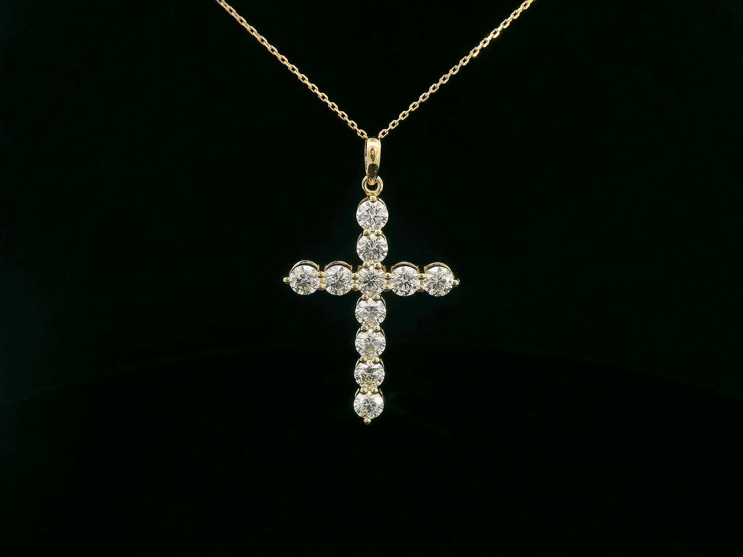 18K yellow gold cross pendant set with 11 round-cut diamonds totaling 2.21 carats (chain not included)