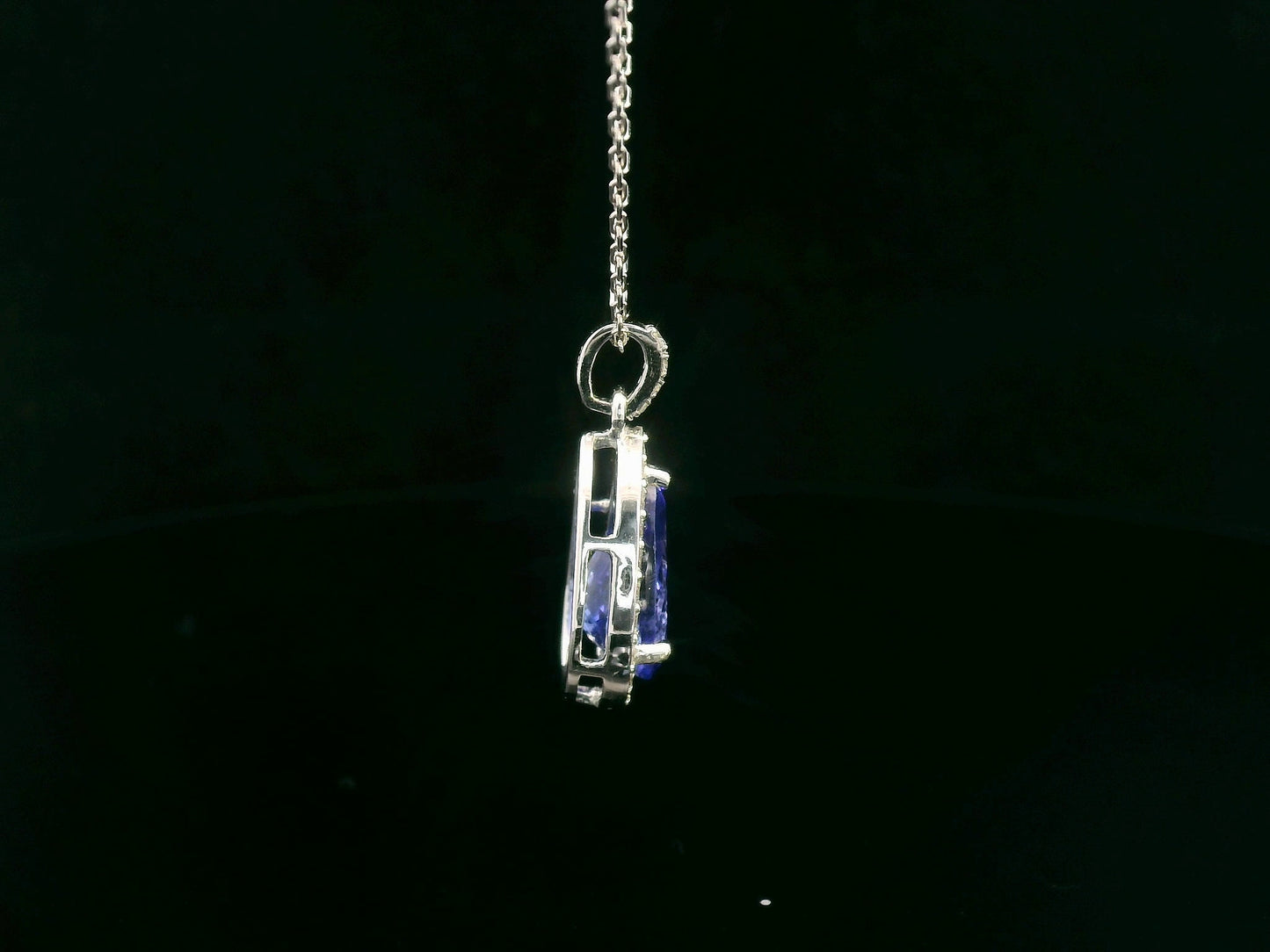 Pear-shaped Tanzanite pendant in 18K white gold with diamond halo and diamond-studded bail – 2.81ct total