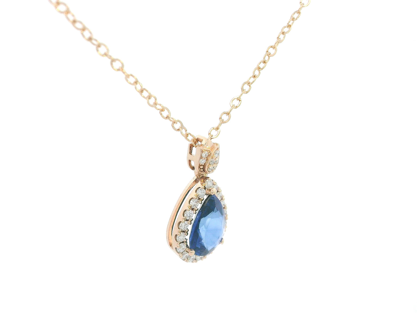 Diamond halo pendant with teardrop sapphire and tulip-style bail