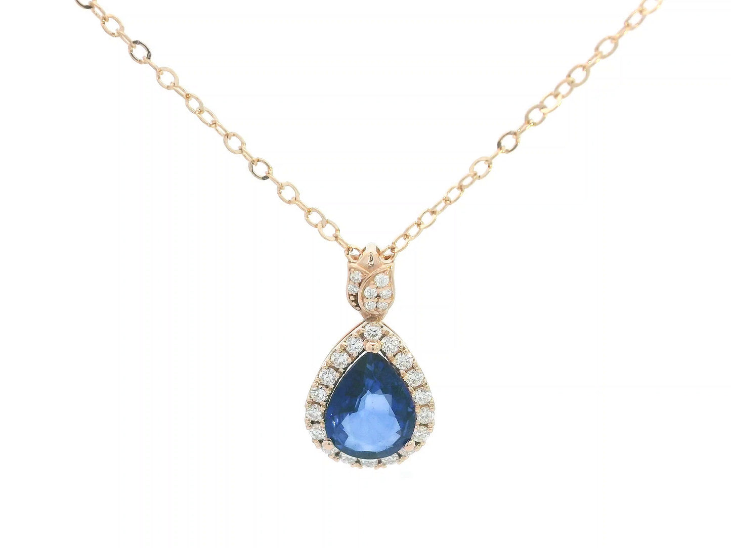 Teardrop-shaped blue gemstone necklace with gold chain on a white background
