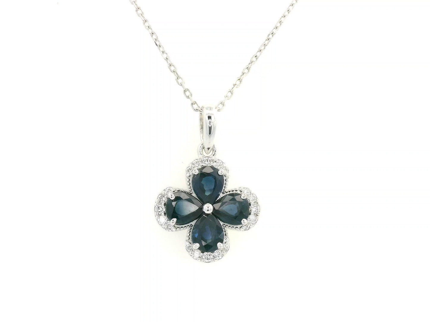 Floral sapphire pendant in 18K white gold with diamond accents