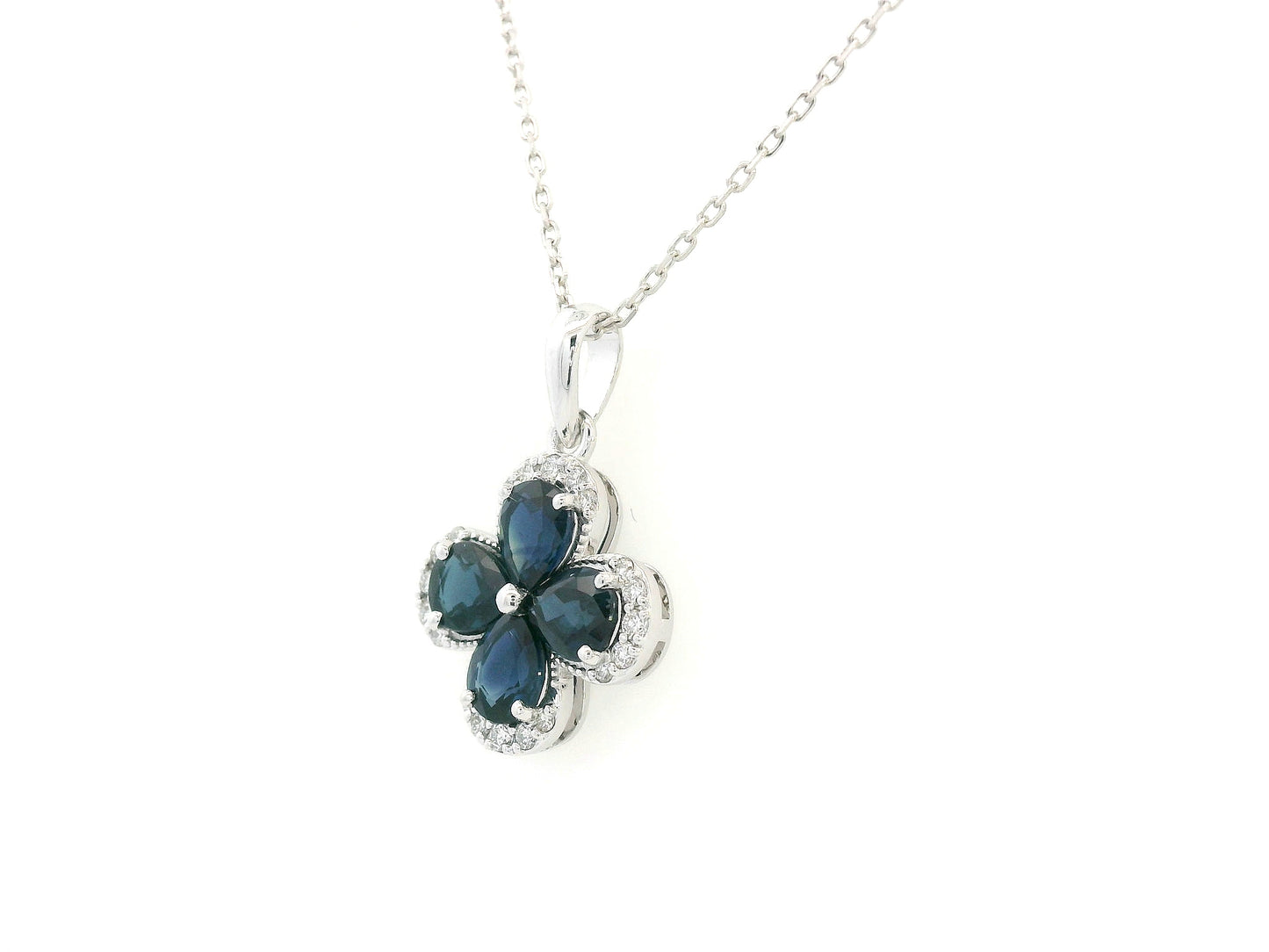 Blue sapphire and diamond flower pendant for women