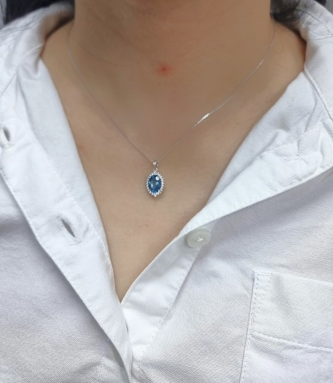 18k white gold oval London Blue Topaz halo pendant with diamonds – chain not included”