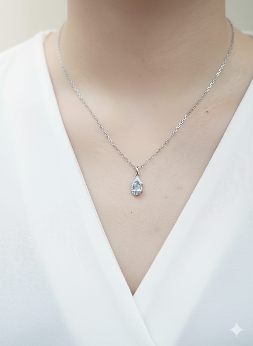 18k white gold pendant with 0.57ct pear aquamarine & 0.08ct diamond halo – certified authenticity included