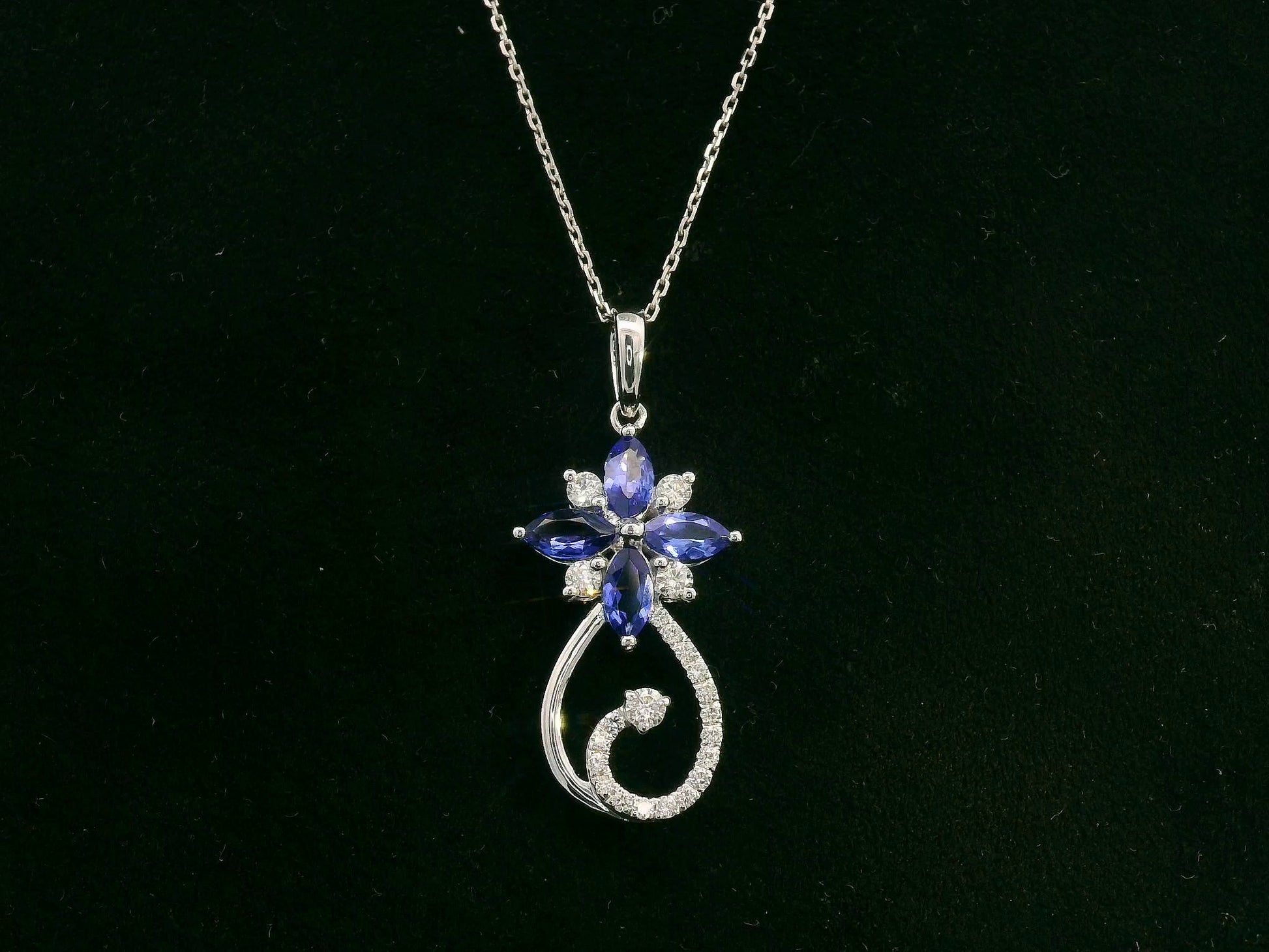 18K white gold Tanzanite and diamond floral paisley pendant featuring marquise-cut Tanzanites and pavé-set diamonds