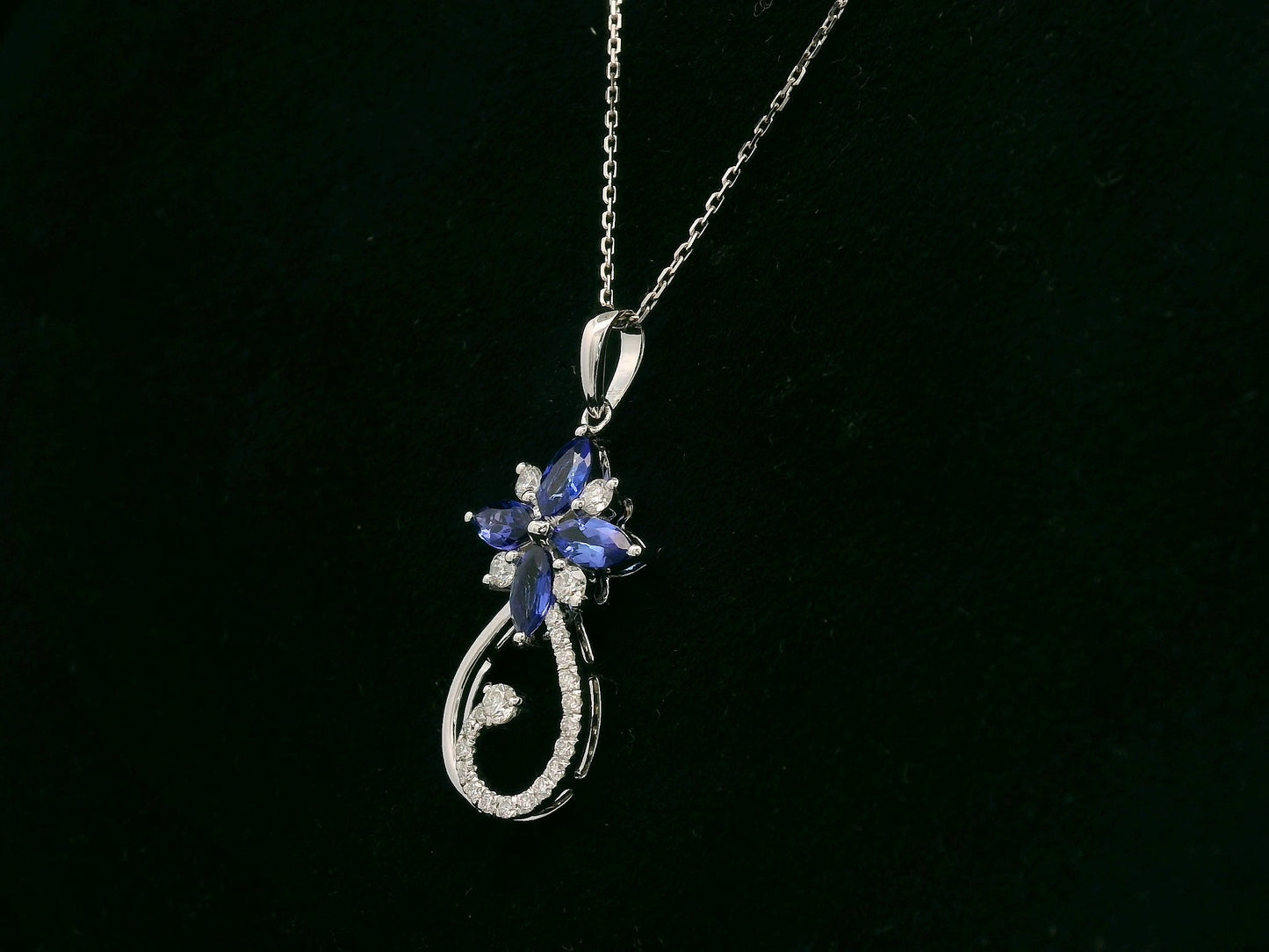 18K white gold Tanzanite and diamond floral paisley pendant featuring marquise-cut Tanzanites and pavé-set diamonds