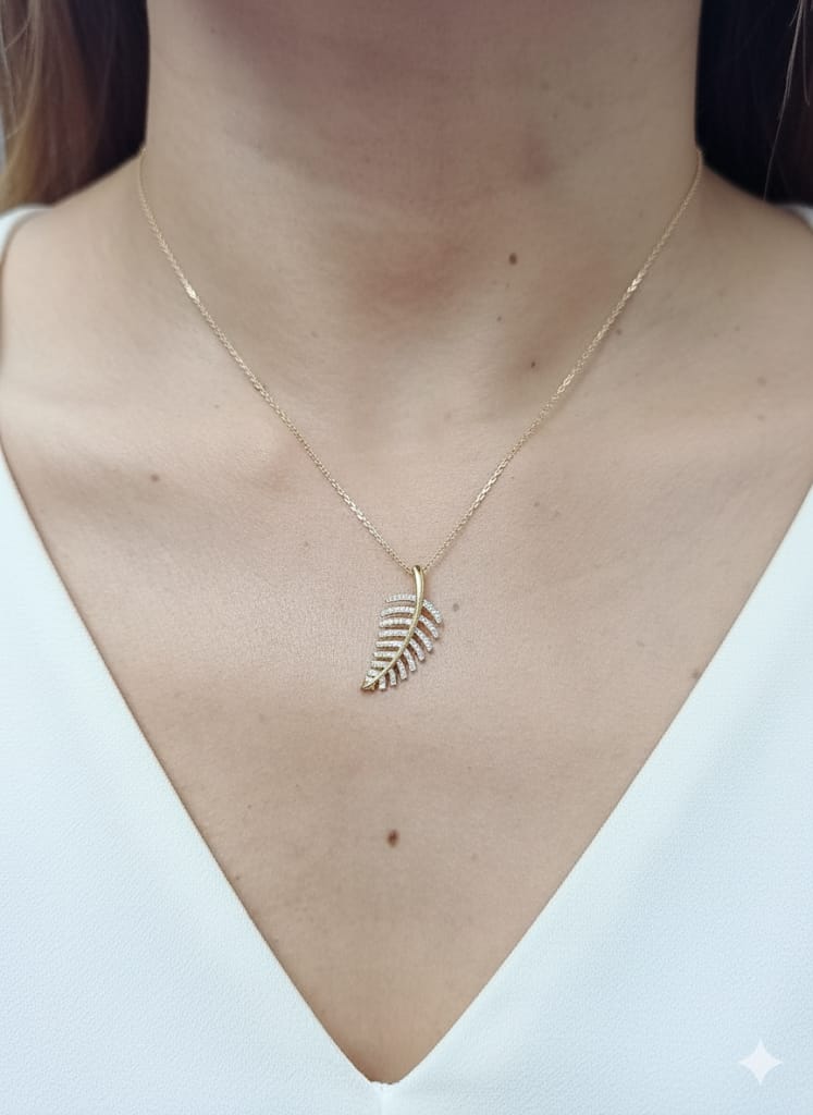 18K yellow gold leaf-shaped pendant with pavé-set diamonds, elegant nature-inspired jewelry