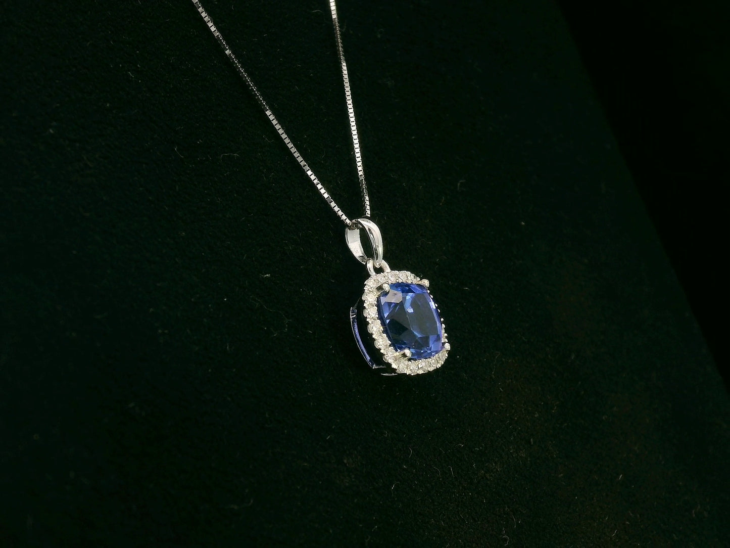 18K white gold Tanzanite and diamond halo pendant with cushion-cut 2.02 carat center stone
