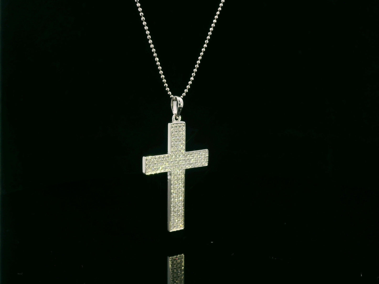 0.80 carat diamond cross pendant in 18K white gold pavé set by Emirates Diamonds