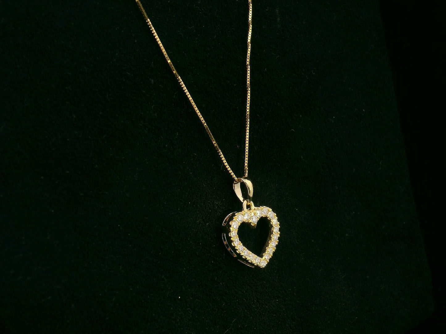 18K yellow gold diamond heart pendant with pavé-set diamonds, elegant open heart design by Emirates Diamonds.