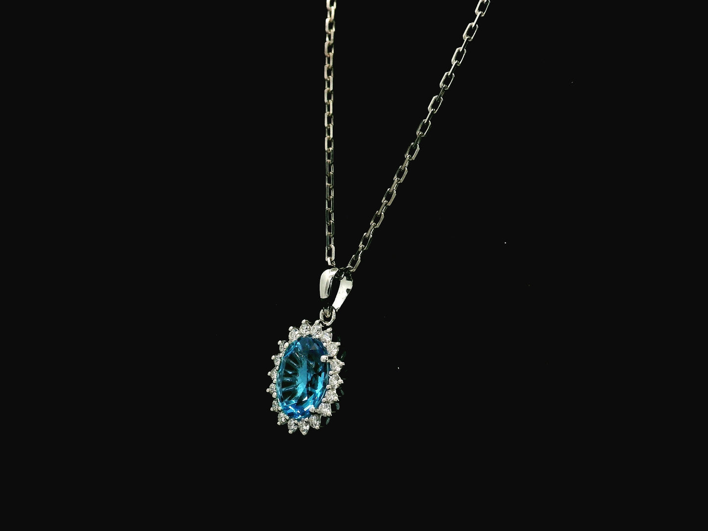 Swiss blue topaz and diamond halo pendant in 18K white gold – Emirates Diamonds